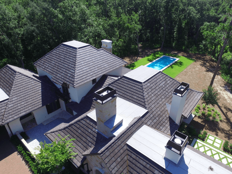 Freshly installed vinyl siding and a newly replaced roof on a residential property by Coastal Siding & Windows in Charleston, SC